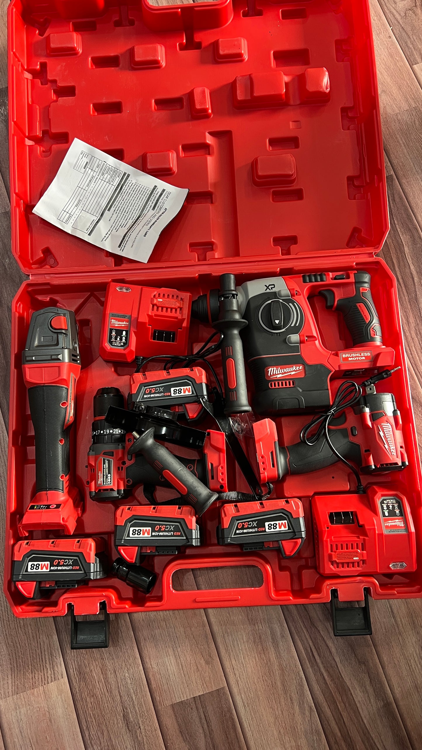 Milwaukee 4-in-1 Cordless Power Tool Kit – Drill, Impact Wrench, Angle Grinder & Rotary Hammer with Batteries and Carry Case